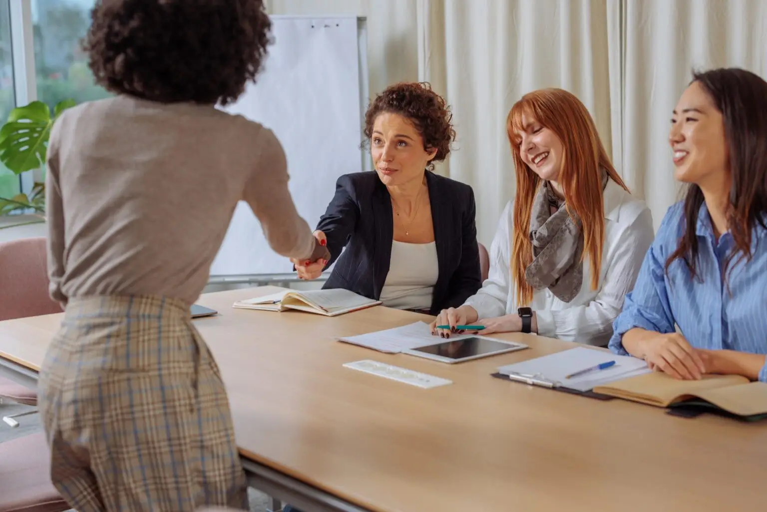 Businesswomen,Are,Sitting,Inside,Of,The,Glass,Office,,Doing,An