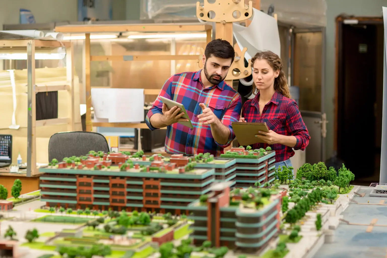 One,Of,Young,Architects,Explaining,His,Colleague,Some,Technical,Details